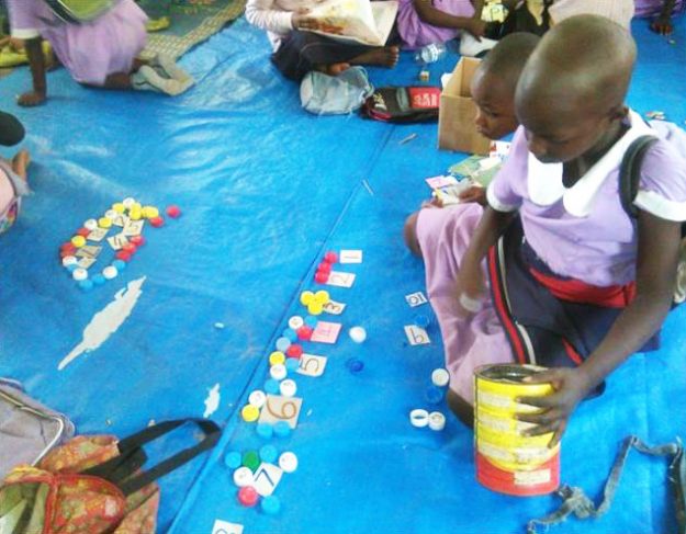 Bottles Tops Girls Using Bottle tops to count