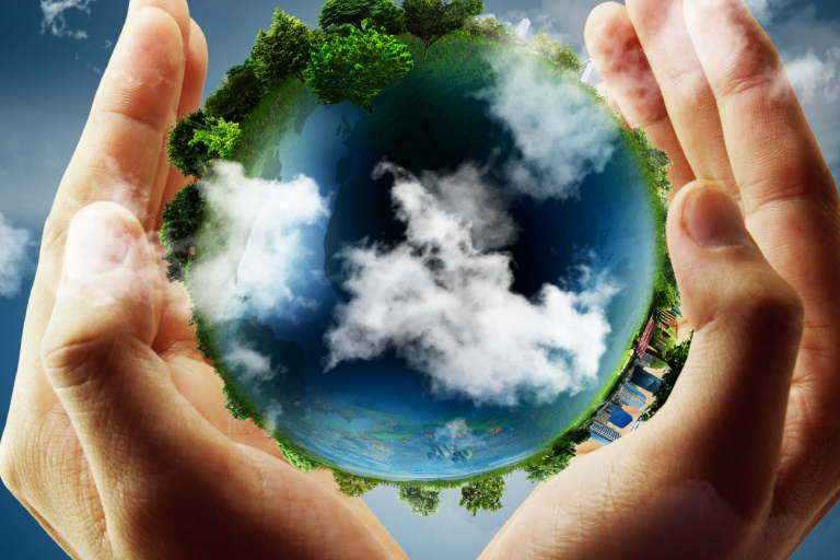 Globe held between two hand.